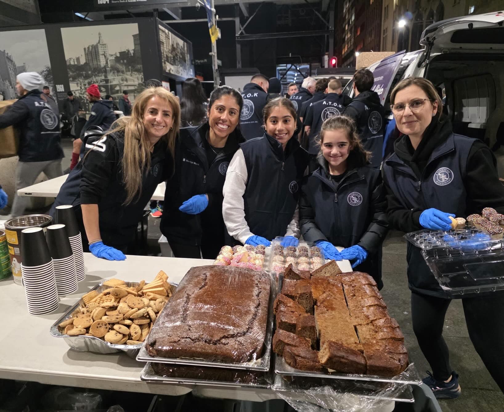 A table of bread, cakes and brownies ready to be served