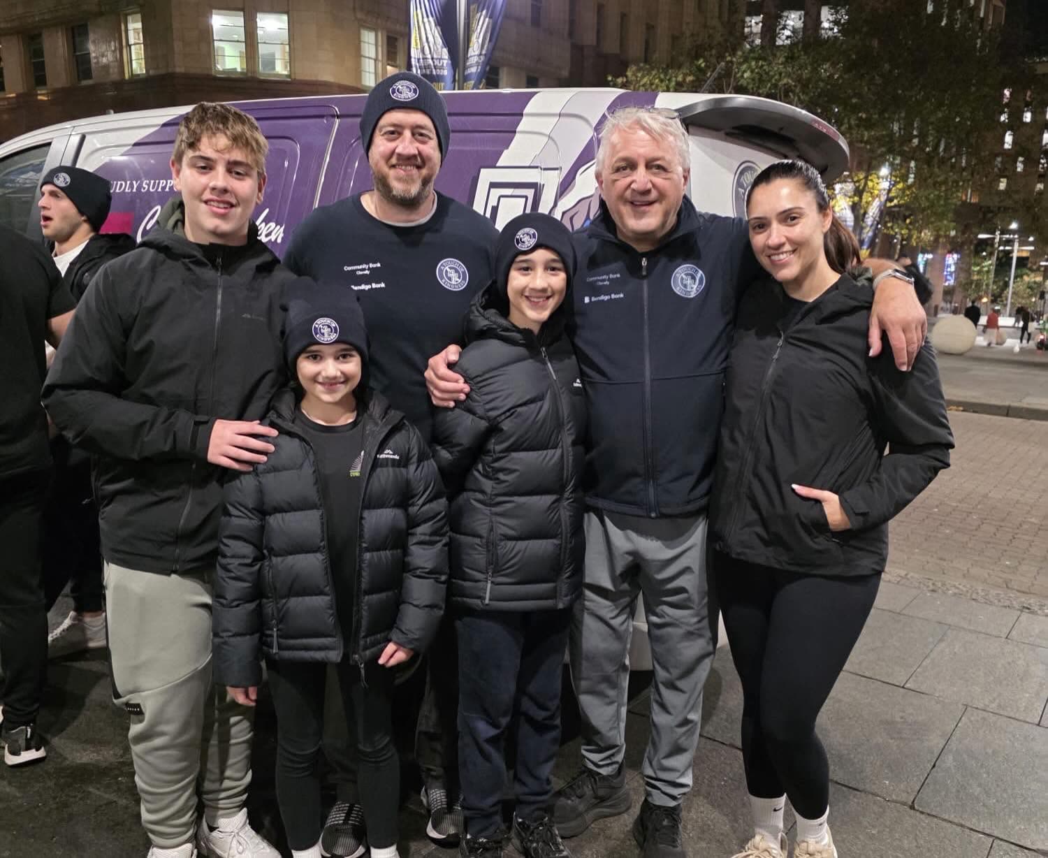 A family of volunteers together at Martin Place